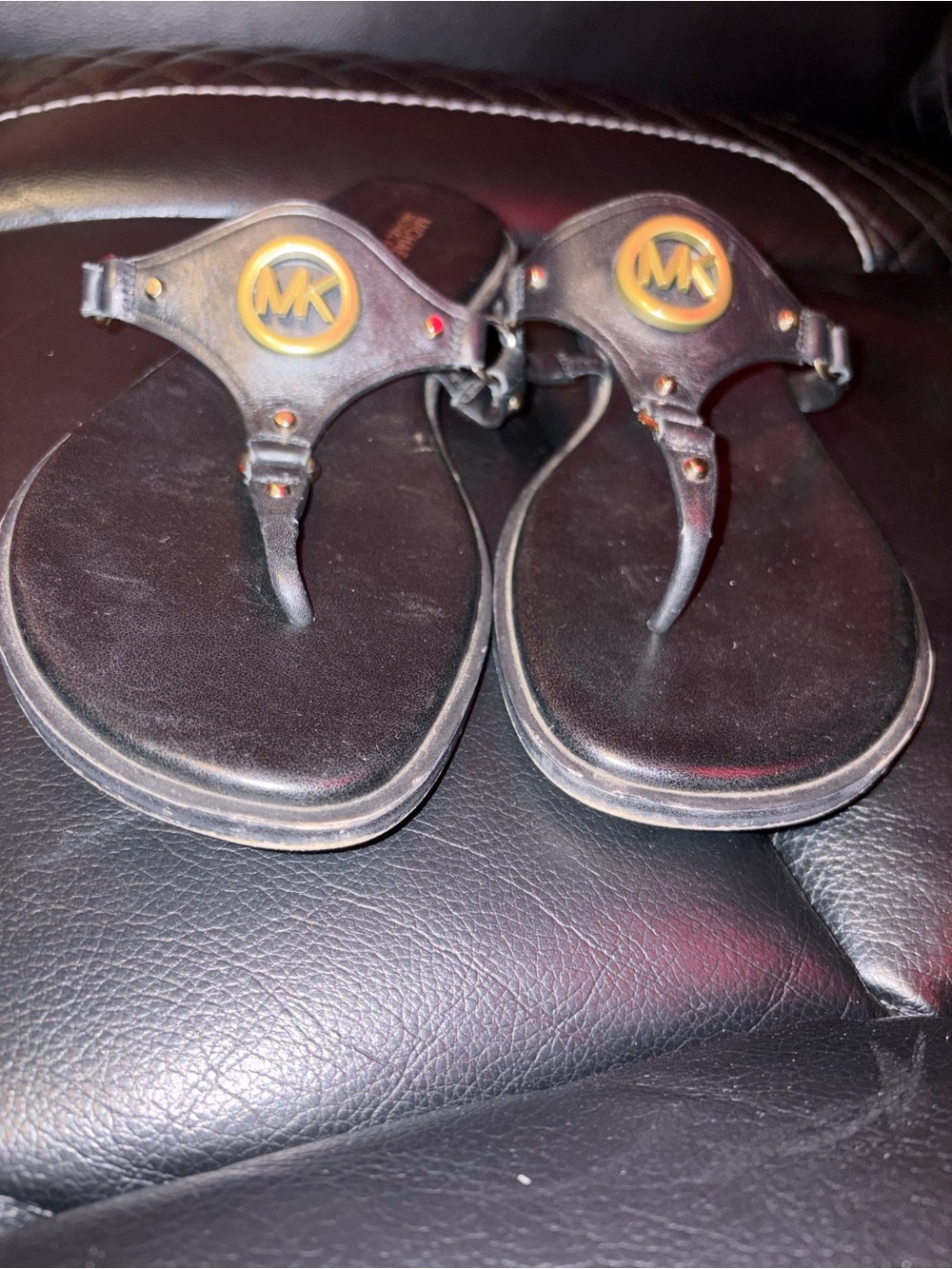 Michael Kors Black Leather T-strap Sandals with Gold MK Medallions